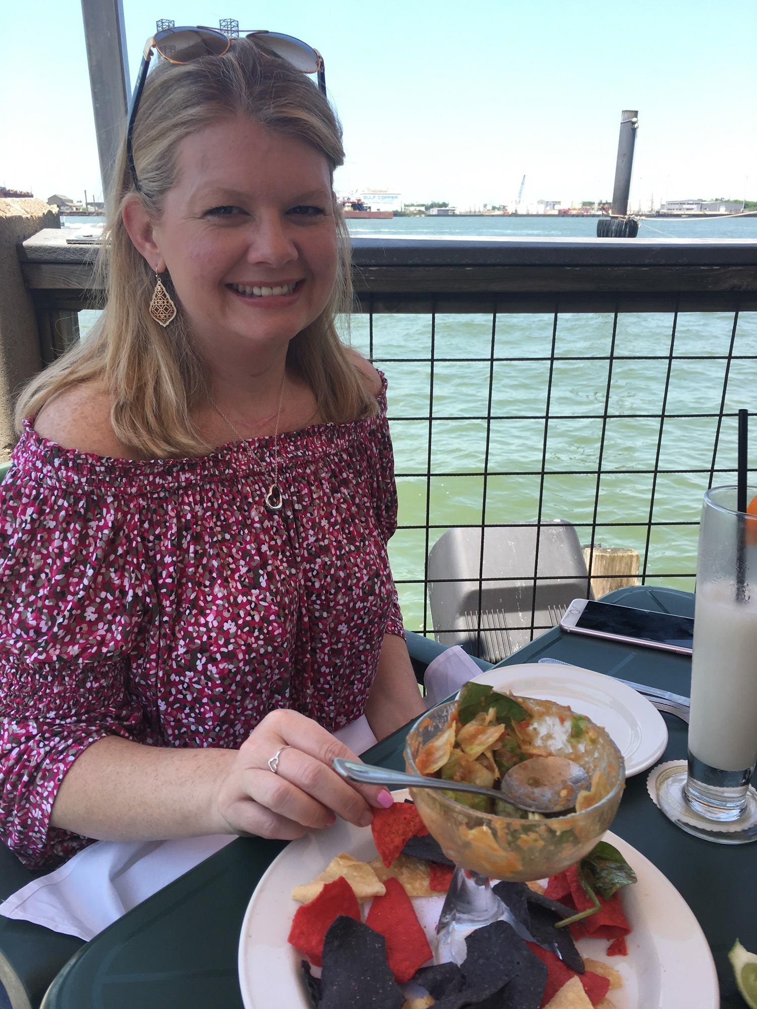 Brandie enjoying lunch by the water in another seaside location planned by John