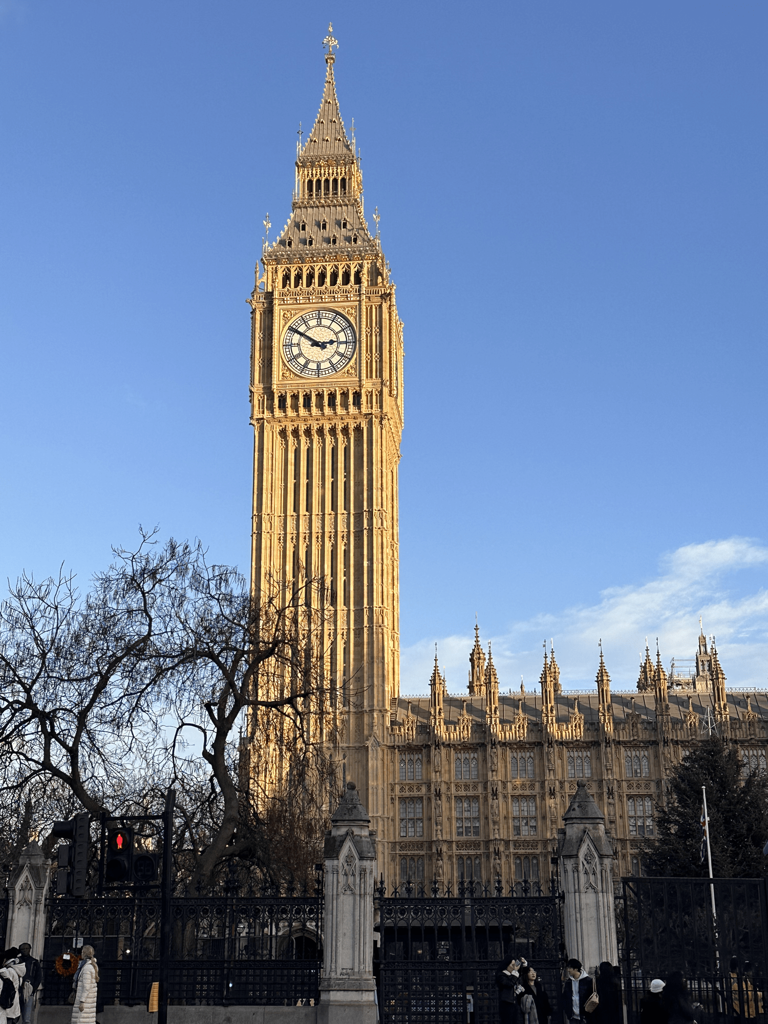 Big Ben atop the Elizabeth Tower in front of a beautiful blue sky, on a chilly winter day in London
